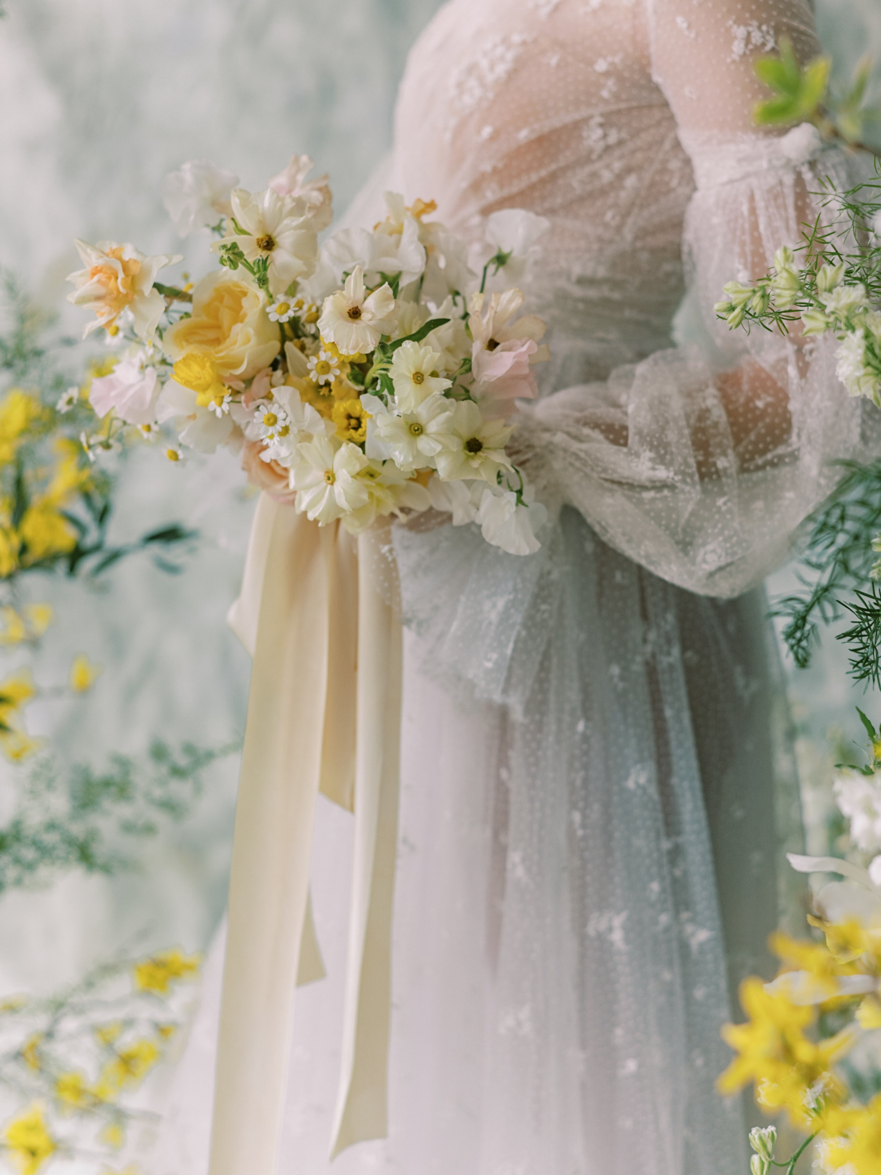 embroidered lace dress with soft yellow bouquet with roses and ranunculus 