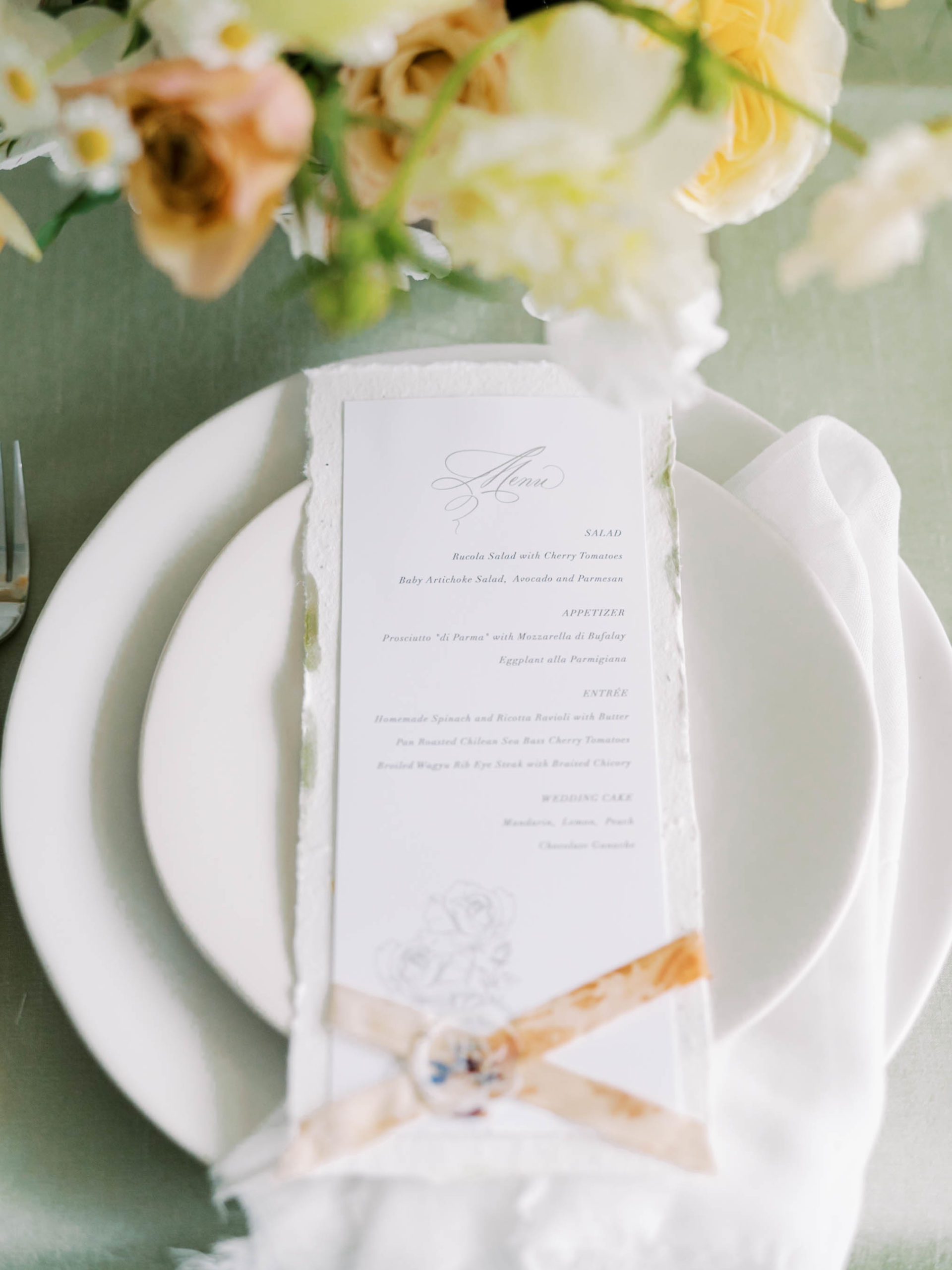 Rachelle lettering menu on white table setting 