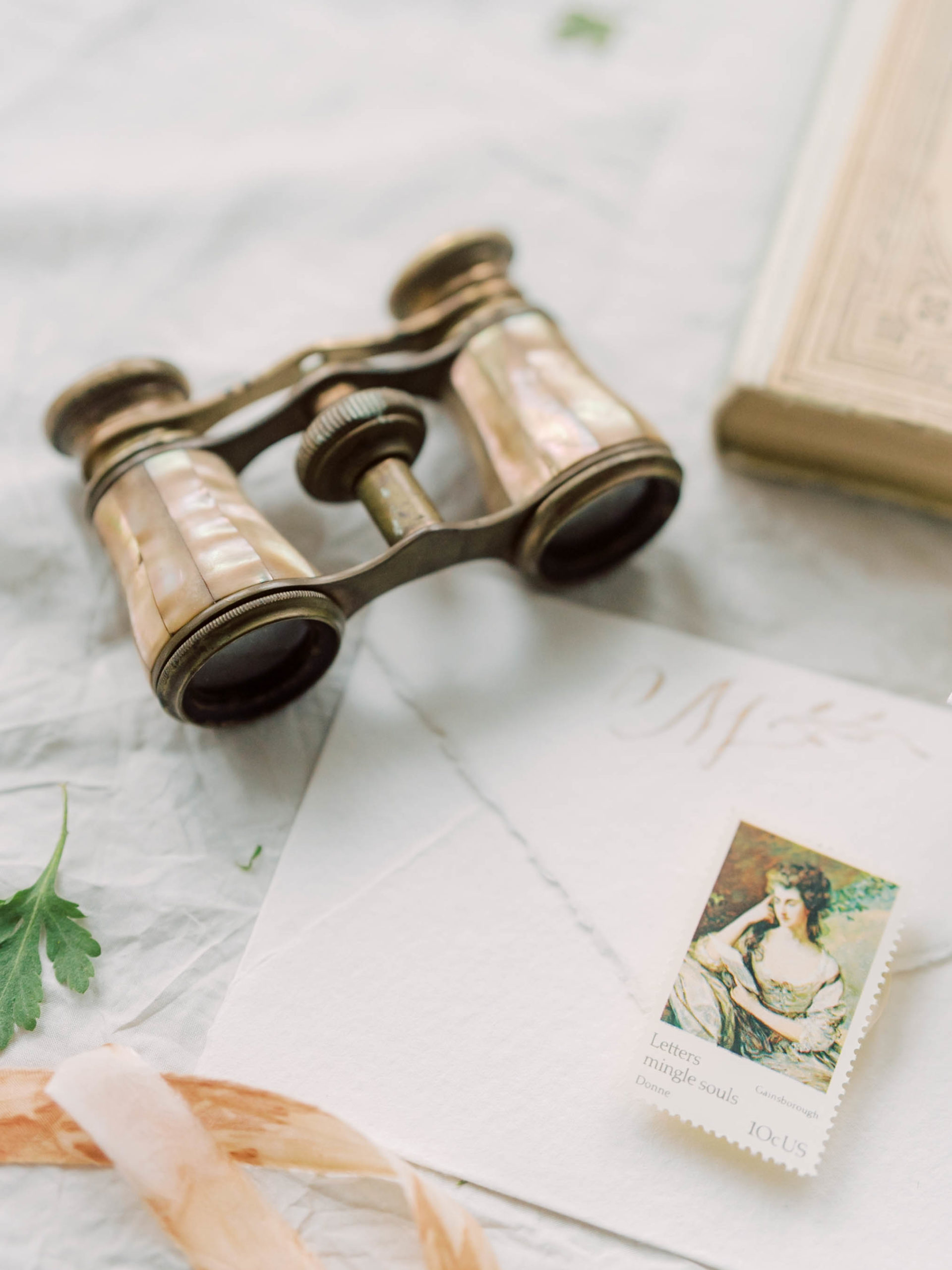 invitations with vintage stamps, vintage opera glasses editorial photoshoot for photographers